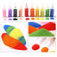 A set of small squeeze bottles filled with colorful powder or pigment, shown above close-up panels of the same colors as loose powders and sand. The bottles include pink, purple, black, tan, red, orange, yellow, green, blue, and white, and the inset images show the powders and sand in bright rainbow colors.