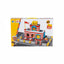A toy building block set showing the assembled red and white fire station model, its retail packaging box, a white plastic tray, and bags of loose blocks and small black pieces on a gray surface.